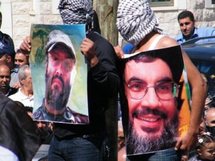صورتا حسن نصرالله وعماد مغنية مع المساركين بيوم الشهداء القادة صورتا حسن نصرالله وعماد مغنية مع المساركين بيوم الشهداء القادة