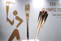اليابان تستقبل الشعلة الأولمبية باحتفالية مبسطة و حالة من الضبابية  