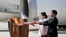 اليابانيون يتحدون فيروس كورونا لمشاهدة الشعلة الأولمبية