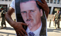 الاسد "سيعيش ويموت" في سوريا وتقدم في مفاوضات الدوحة لتوحيد المعارضة