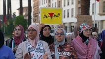 المشاركات رددن شعارات تطالب المجتمع الدولي بحماية المرأة الفلسطينية- ايه ايه
