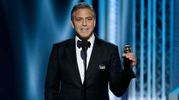 جورج كلوني يتعاطف مع " شارلي" و قفازات زوجته تلفت الانظار