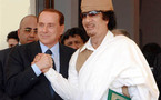 برلسكوني يدافع عن صداقته مع القذافي ويدحض اتهامات المعارضة له بالركوع لليبيين