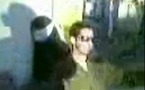جندي اسرائيلي يقوم بوصلة رقص شرقي حول سجينة فلسطينية محجبة مكبلة ومعصوبة العينين