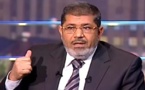 مرسي يدعو الأسد للتخلي عن السلطة ويطالب بمحاكمته كمجرم حرب
