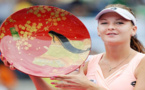 نجمة كرة المضرب البولندية "رادفانسكا" تدافع عن صورتها العارية التي أثارت جدلاً